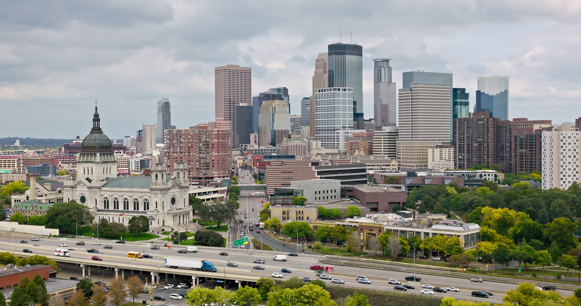 I-94 Passing Basilica of Saint Mary and Downtown Minneapolis Skyline - Aerial